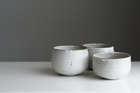 Three ceramic bowls made of speckled stoneware